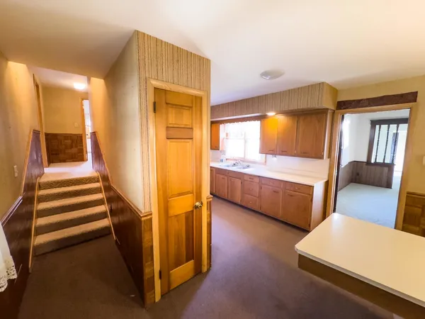 a view of front door with furniture and a window