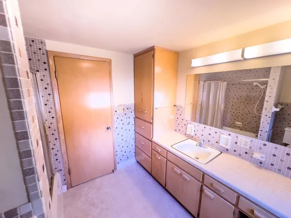 a bathroom with a double vanity sink mirror and double