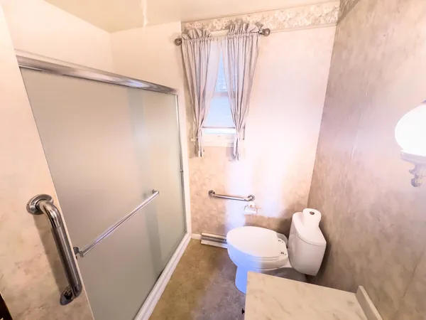 a bathroom with a sink and toilet