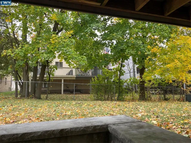 a backyard of a house with lots of green space