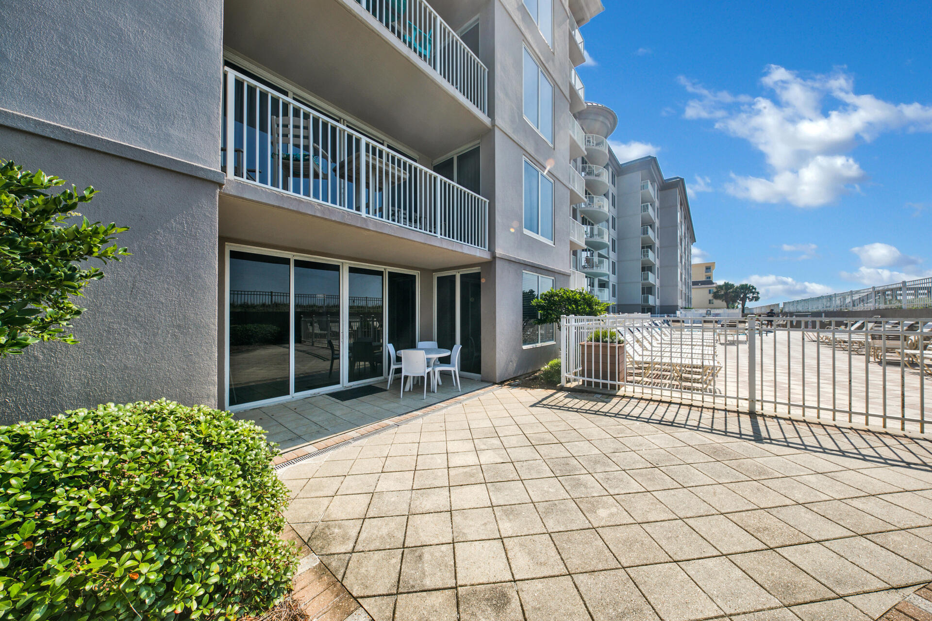 520 Santa Rosa Boulevard, Unit 111 Fort Walton Beach, FL 32548 - Photo 16 of 38 a view of a house with a large window and flower plants