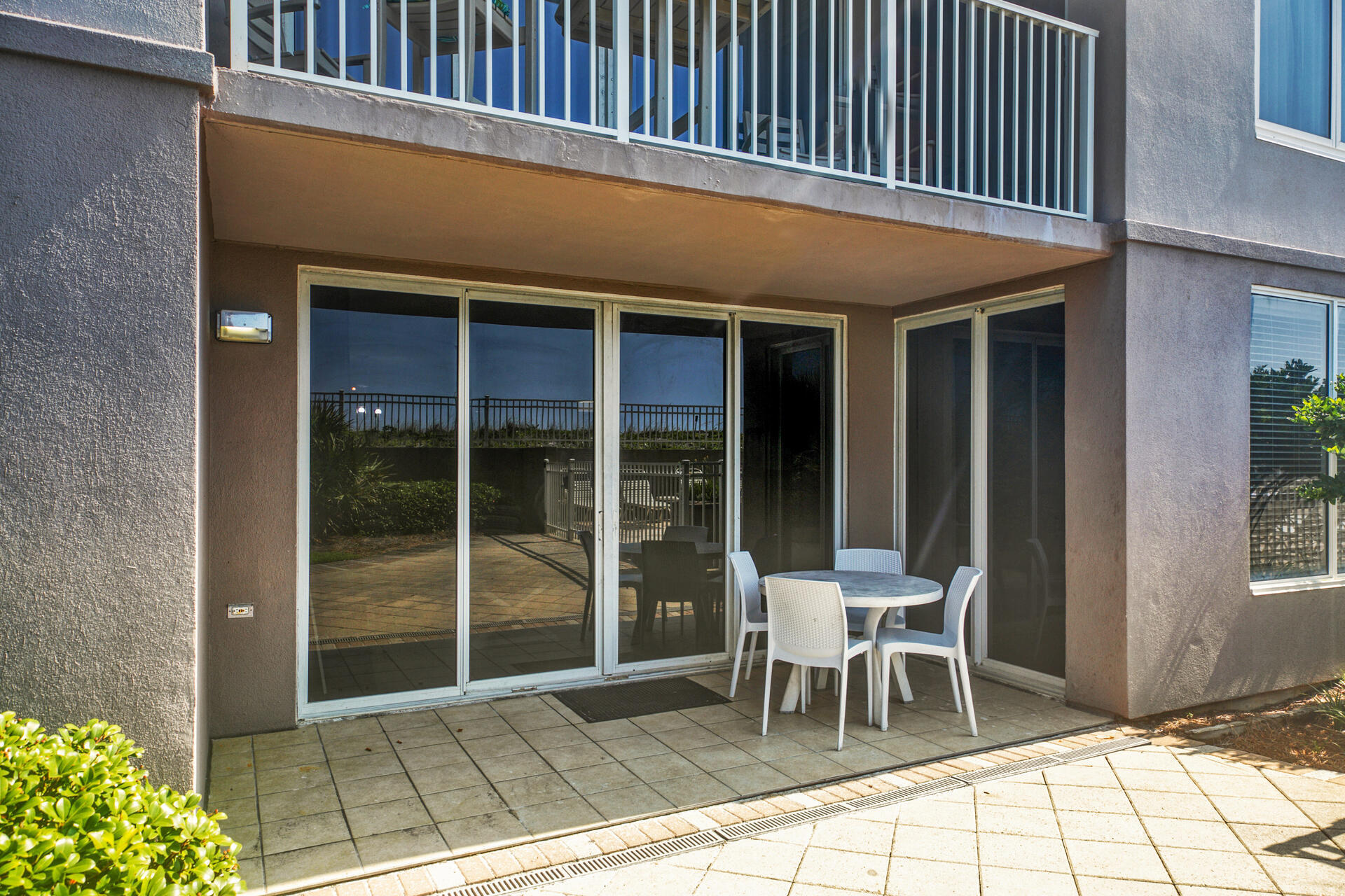 520 Santa Rosa Boulevard, Unit 111 Fort Walton Beach, FL 32548 - Photo 17 of 38 a patio with table and chairs and potted plants