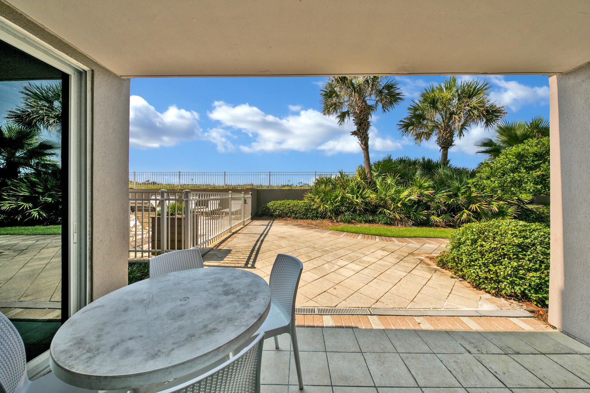 520 Santa Rosa Boulevard, Unit 111 Fort Walton Beach, FL 32548 - Photo 2 of 38 a view of a swimming pool with an outdoor seating and a yard