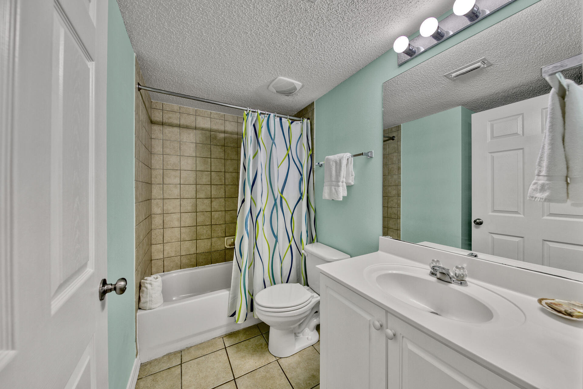 520 Santa Rosa Boulevard, Unit 111 Fort Walton Beach, FL 32548 - Photo 22 of 38 a bathroom with a sink toilet and shower