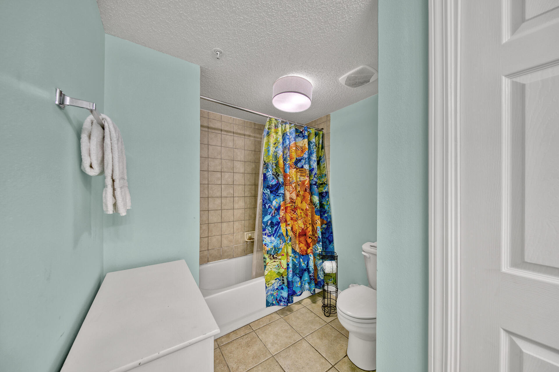520 Santa Rosa Boulevard, Unit 111 Fort Walton Beach, FL 32548 - Photo 24 of 38 a bathroom with a toilet and a shower curtain
