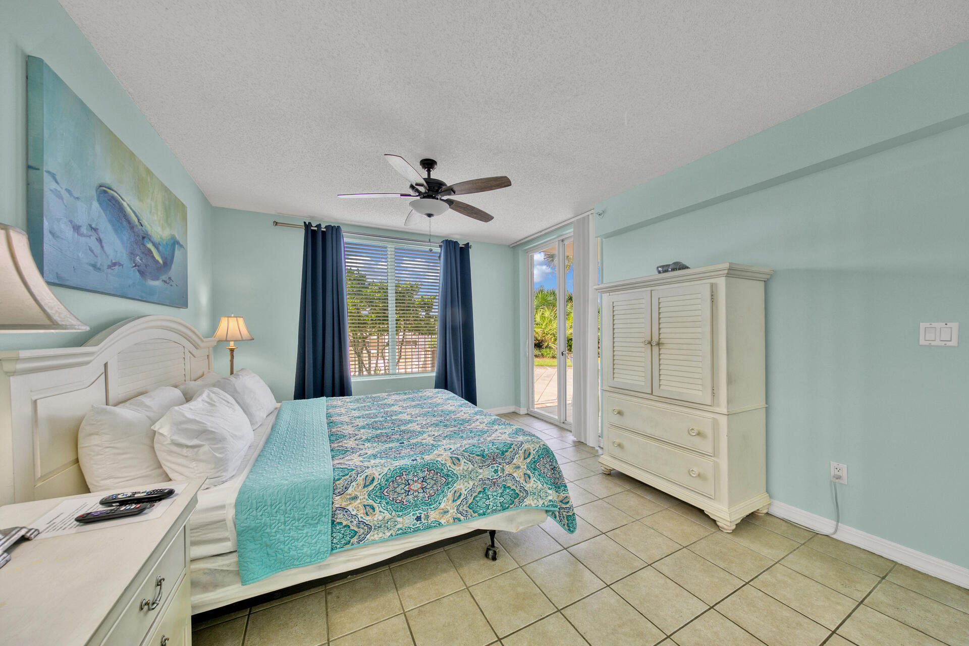 520 Santa Rosa Boulevard, Unit 111 Fort Walton Beach, FL 32548 - Photo 26 of 38 a bedroom with a bed and a chandelier