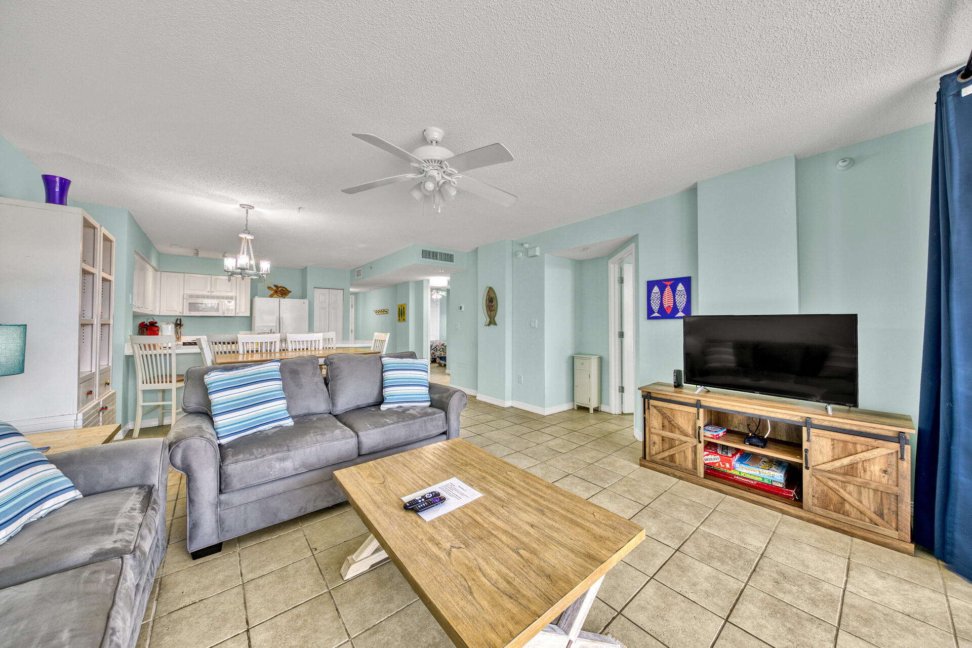 520 Santa Rosa Boulevard, Unit 111 Fort Walton Beach, FL 32548 - Photo 28 of 38 a living room with furniture and a flat screen tv