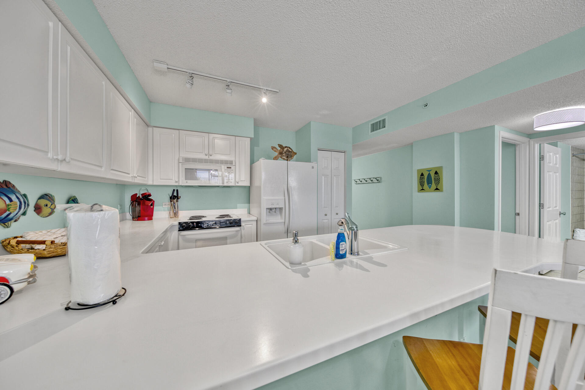 520 Santa Rosa Boulevard, Unit 111 Fort Walton Beach, FL 32548 - Photo 3 of 38 a view of kitchen and sink