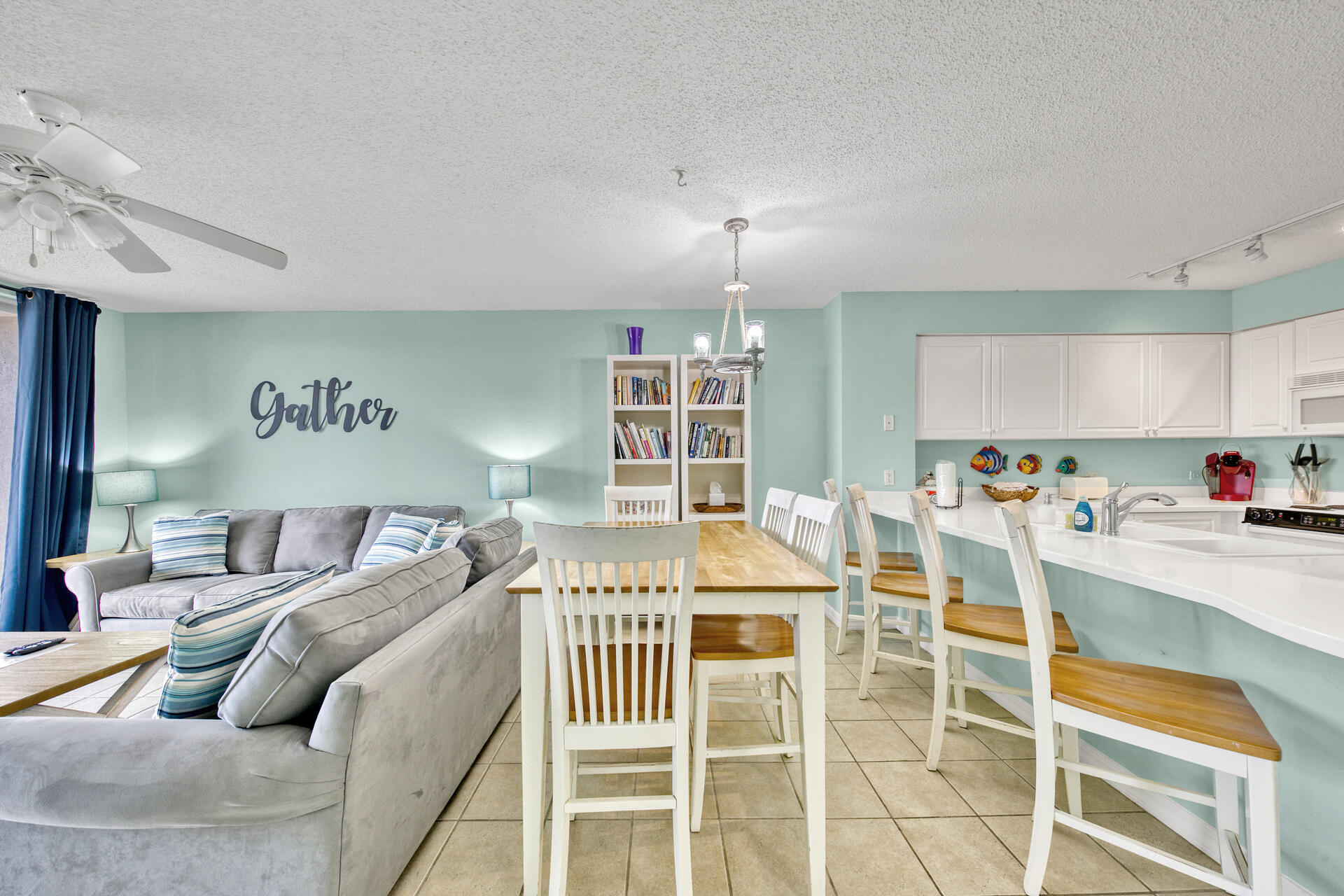520 Santa Rosa Boulevard, Unit 111 Fort Walton Beach, FL 32548 - Photo 32 of 38 a living room with furniture a dining table and chairs