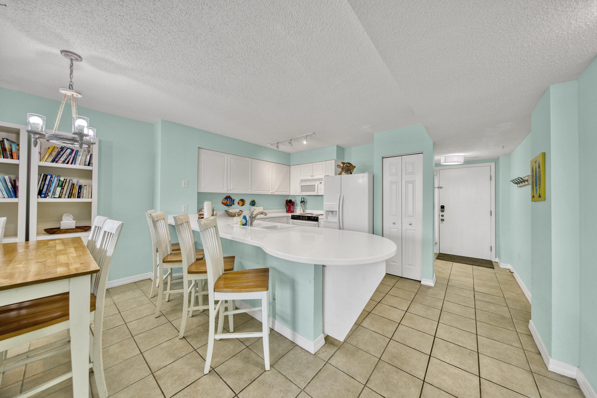 520 Santa Rosa Boulevard, Unit 111 Fort Walton Beach, FL 32548 - Photo 33 of 38 a large white kitchen with a sink and cabinets