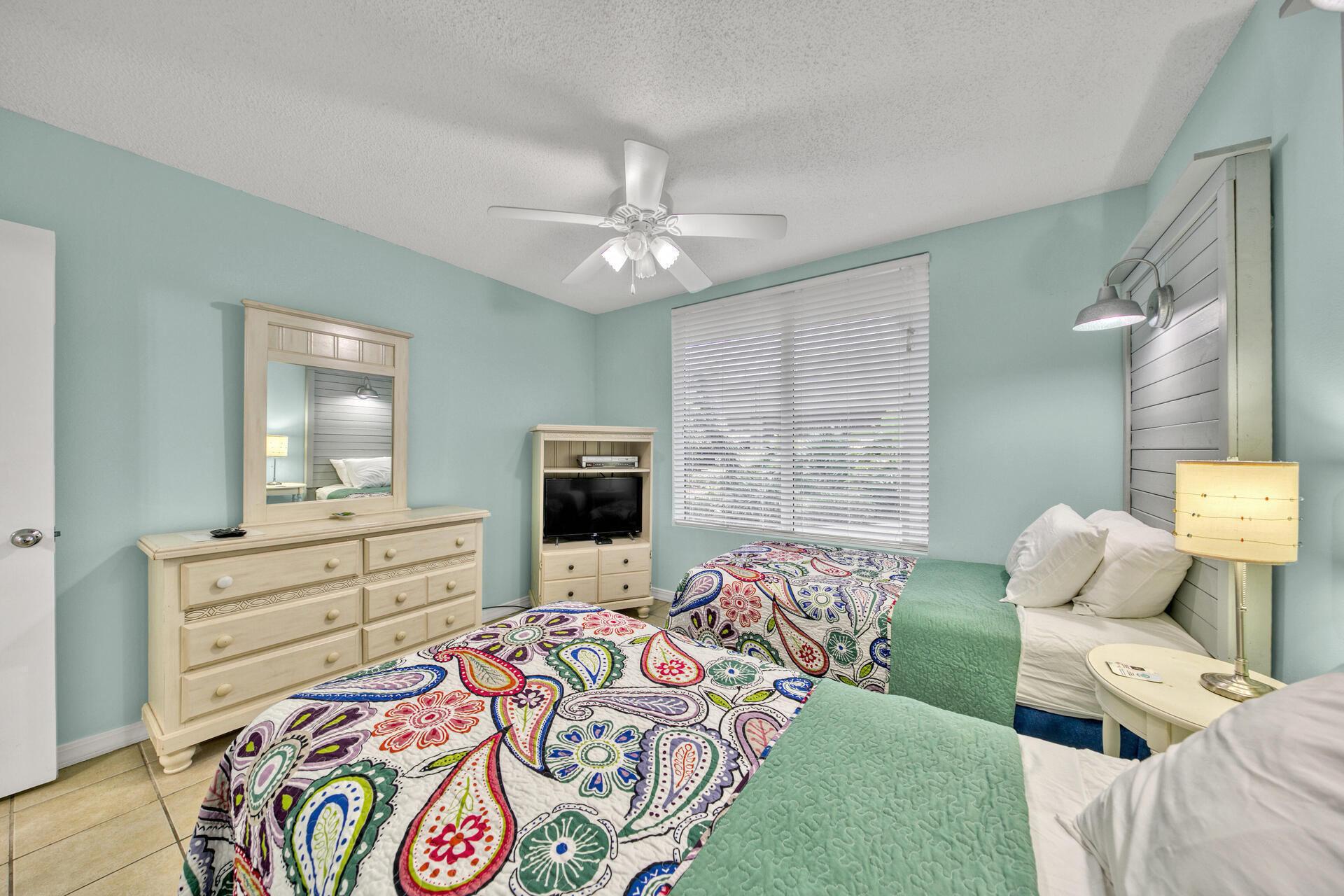 520 Santa Rosa Boulevard, Unit 111 Fort Walton Beach, FL 32548 - Photo 5 of 38 a bed room with a bed and a television