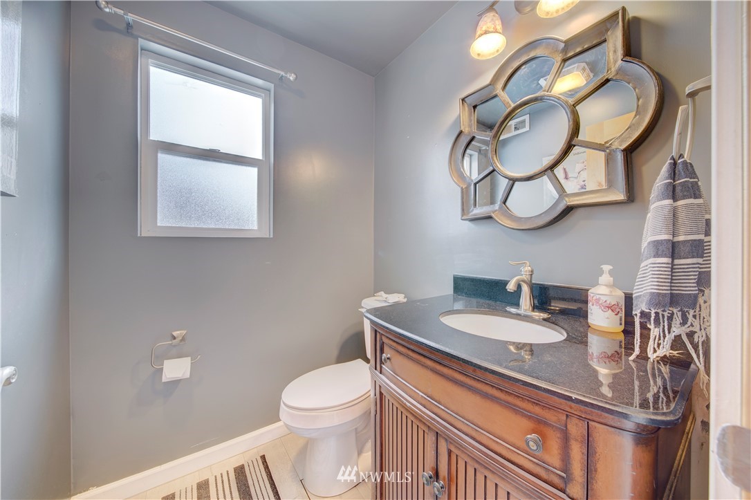 314 Russell Road Snohomish, WA 98290 - Photo 14 of 23 a bathroom with a toilet a sink and a mirror