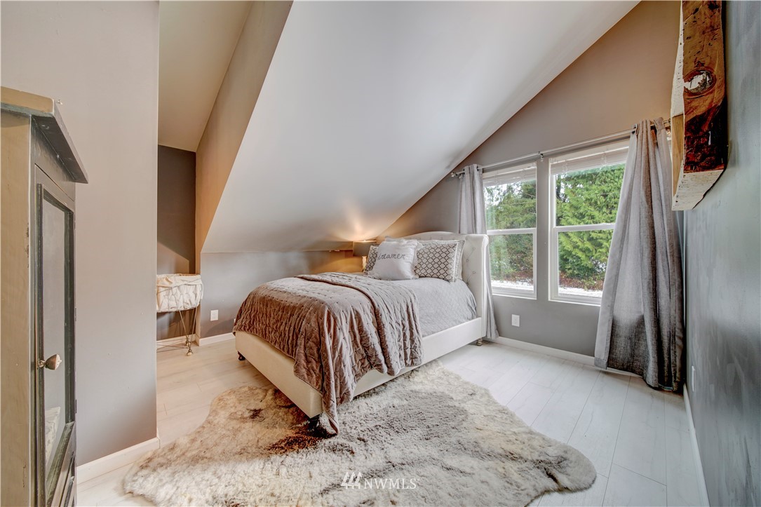314 Russell Road Snohomish, WA 98290 - Photo 19 of 23 a bedroom with a bed and a window