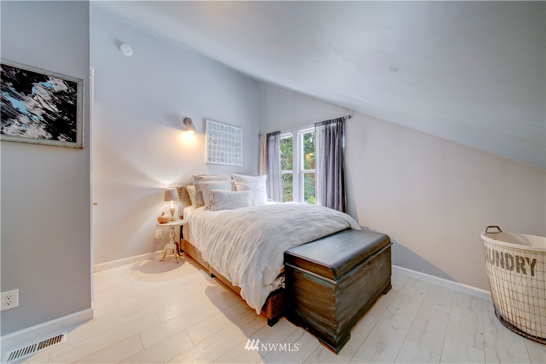 314 Russell Road Snohomish, WA 98290 - Photo 20 of 23 a spacious bedroom with a bed and window