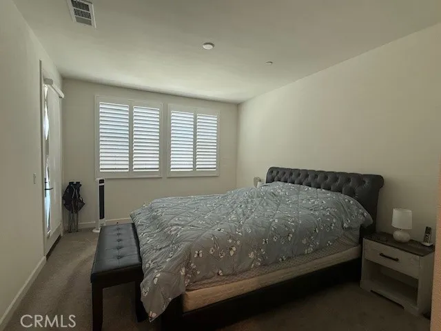 a bathroom with a double vanity sink toilet mirror and shower