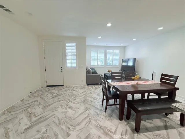 a view of a kitchen and dining room