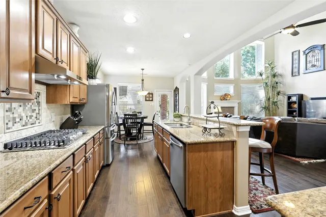 a large kitchen with granite countertop lots of counter top space