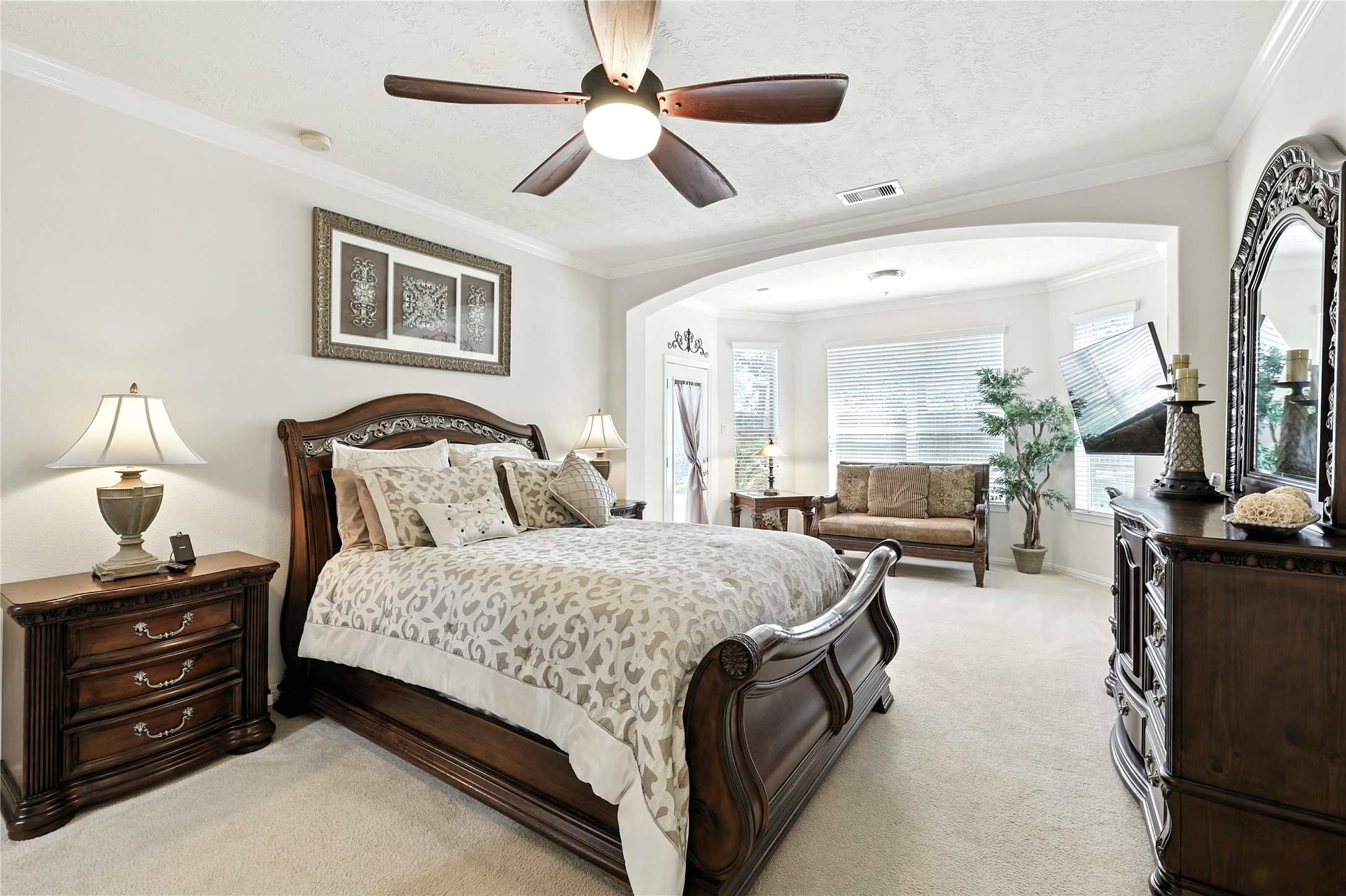 25218 Piney Heights Lane Spring, TX 77389 - Photo 16 of 40 a bedroom with bed and a chandelier