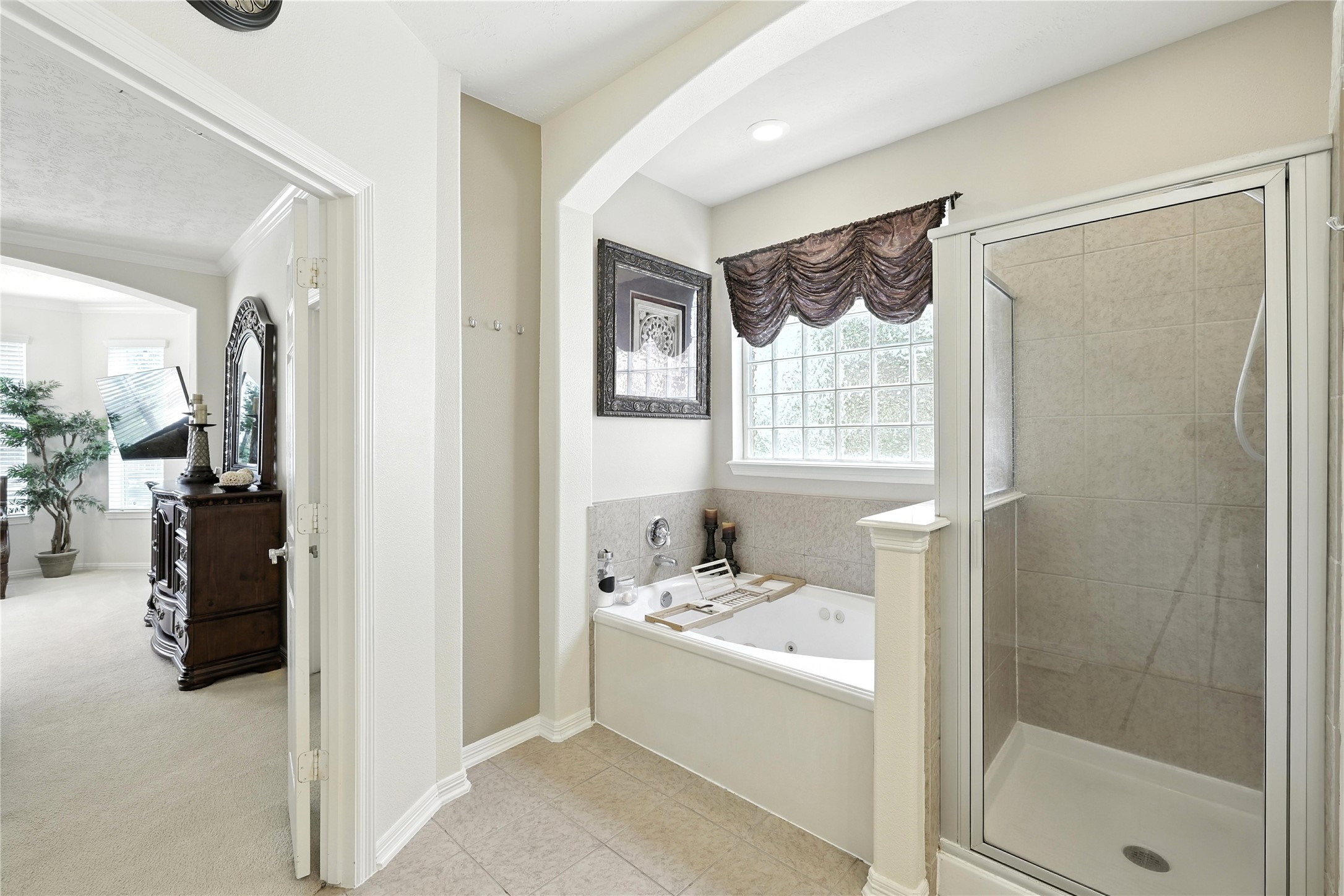 25218 Piney Heights Lane Spring, TX 77389 - Photo 20 of 40 a bathroom with a tub sink and a shower