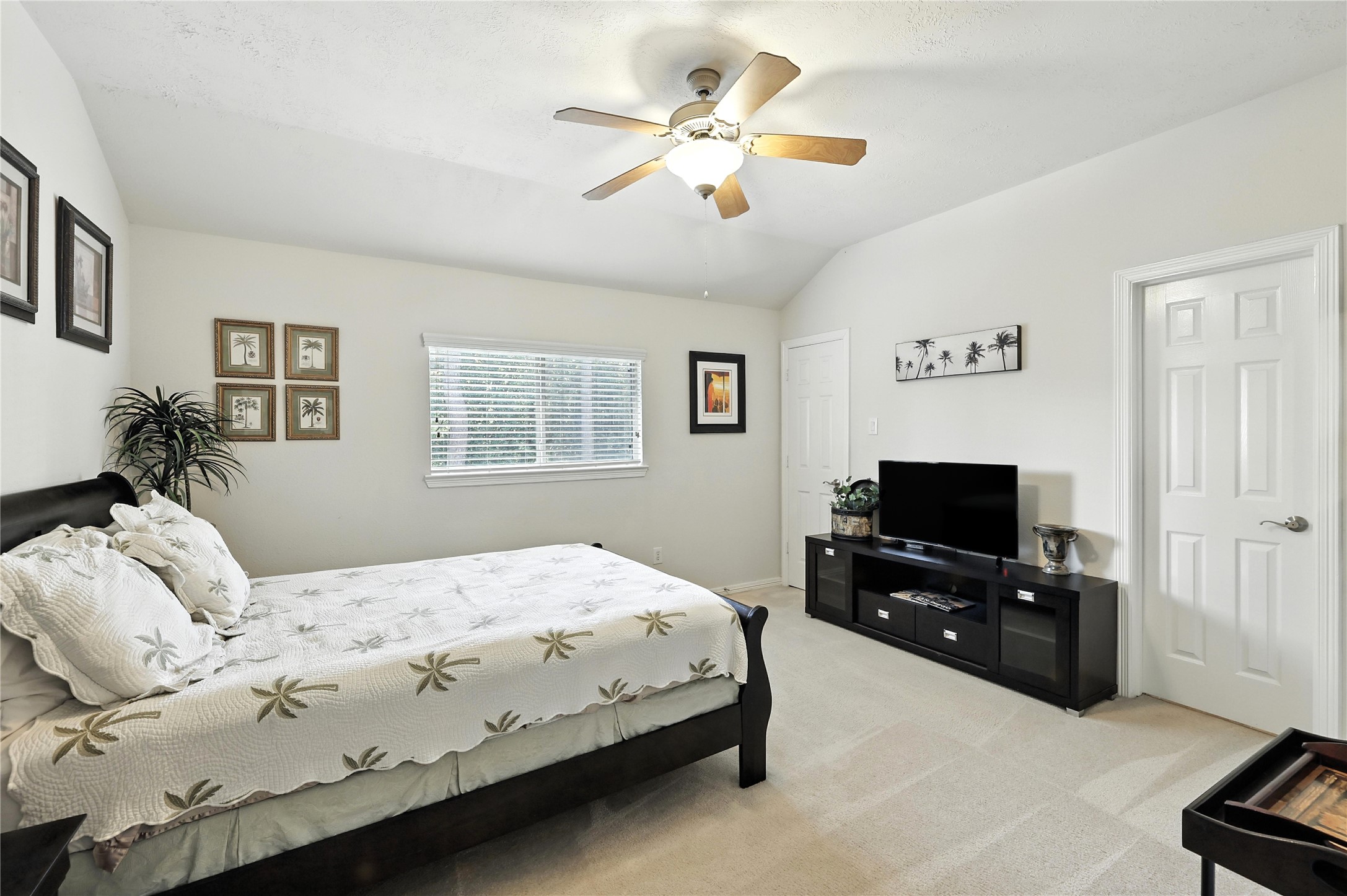 25218 Piney Heights Lane Spring, TX 77389 - Photo 23 of 40 a bedroom with a bed and a flat screen tv