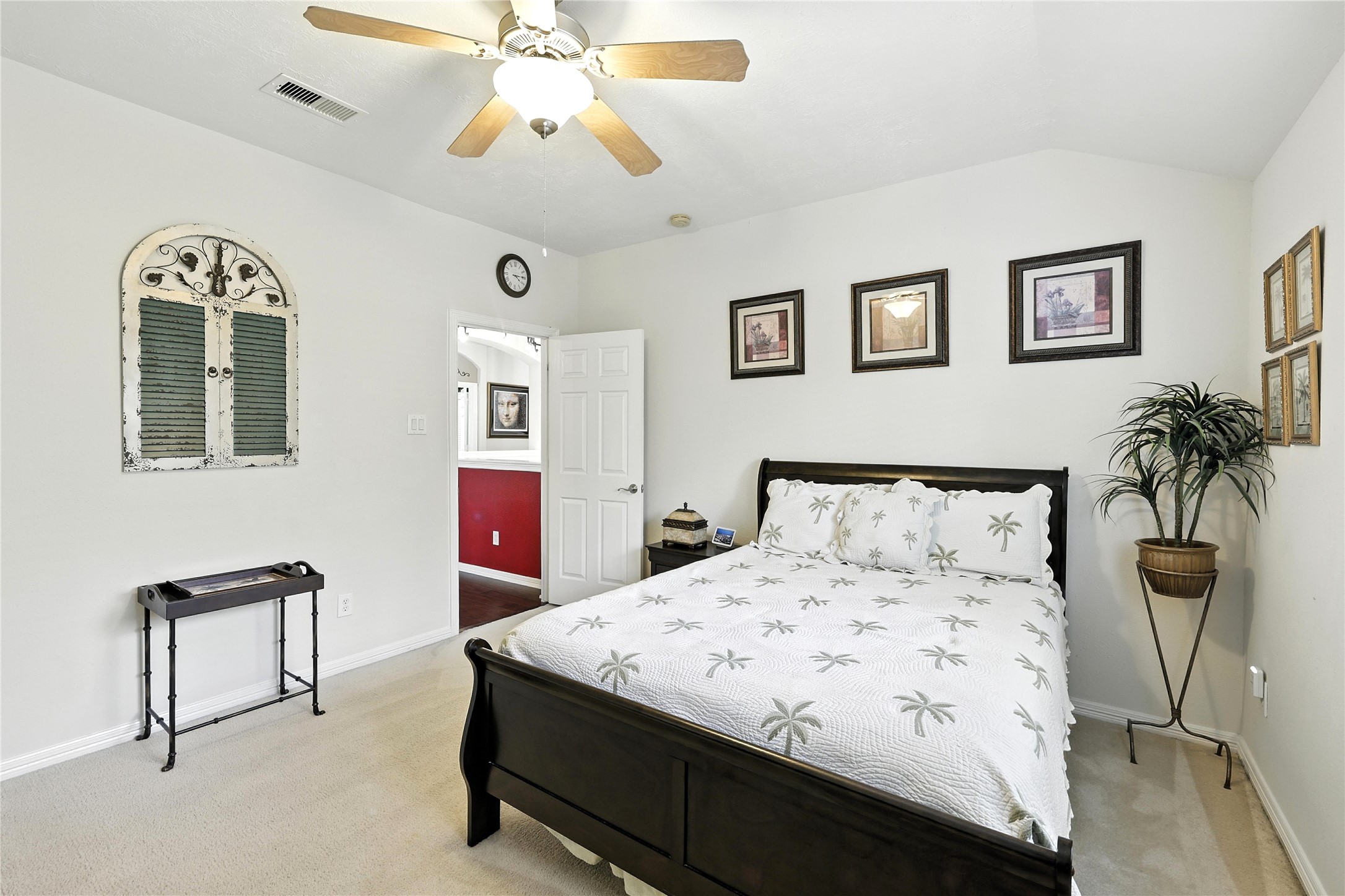 25218 Piney Heights Lane Spring, TX 77389 - Photo 24 of 40 a bedroom with a bed and a chandelier