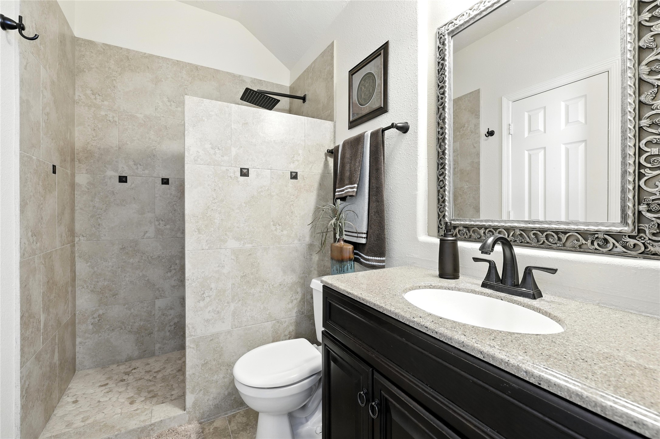 25218 Piney Heights Lane Spring, TX 77389 - Photo 25 of 40 a bathroom with a granite countertop sink toilet and shower