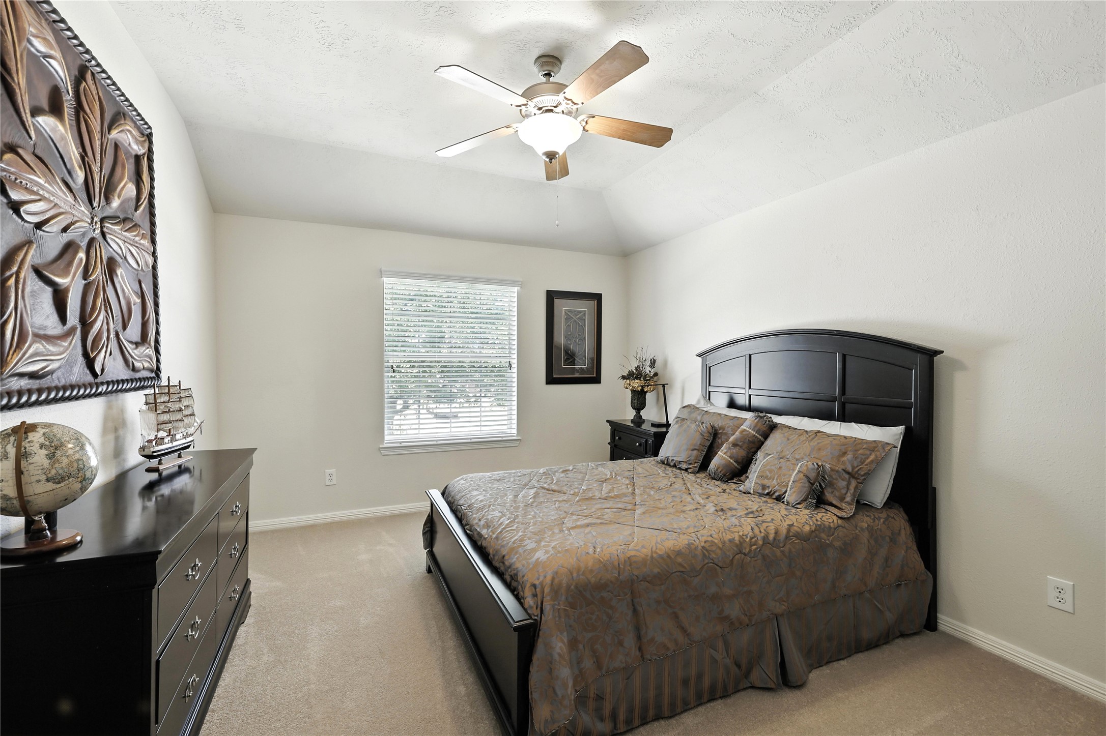 25218 Piney Heights Lane Spring, TX 77389 - Photo 29 of 40 a bedroom with a bed and a chandelier