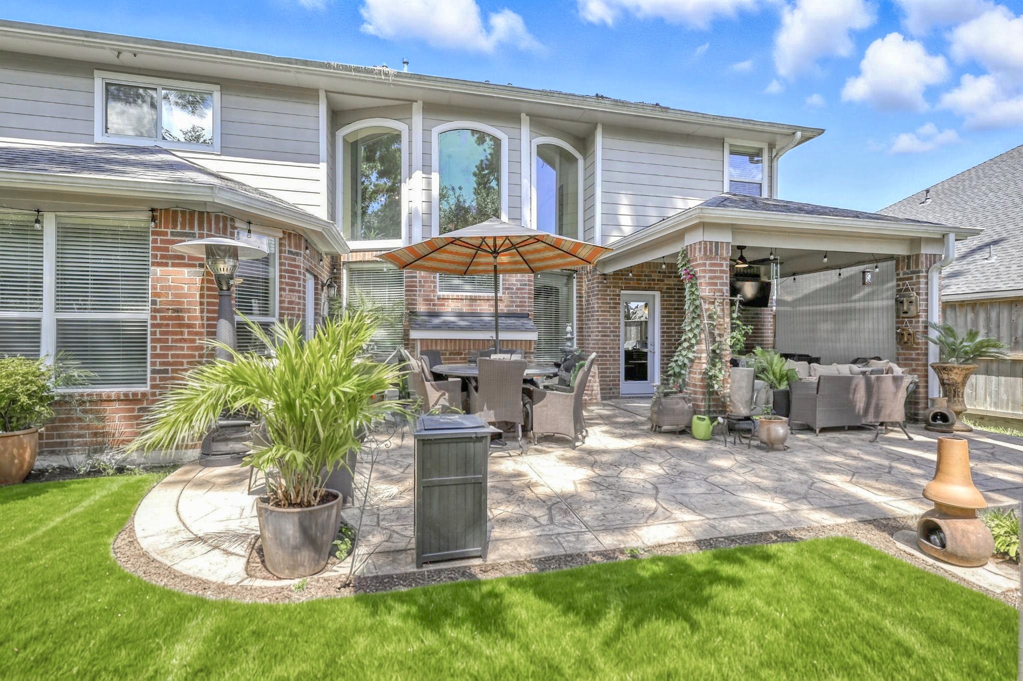 25218 Piney Heights Lane Spring, TX 77389 - Photo 37 of 40 a front view of a house with a yard and porch