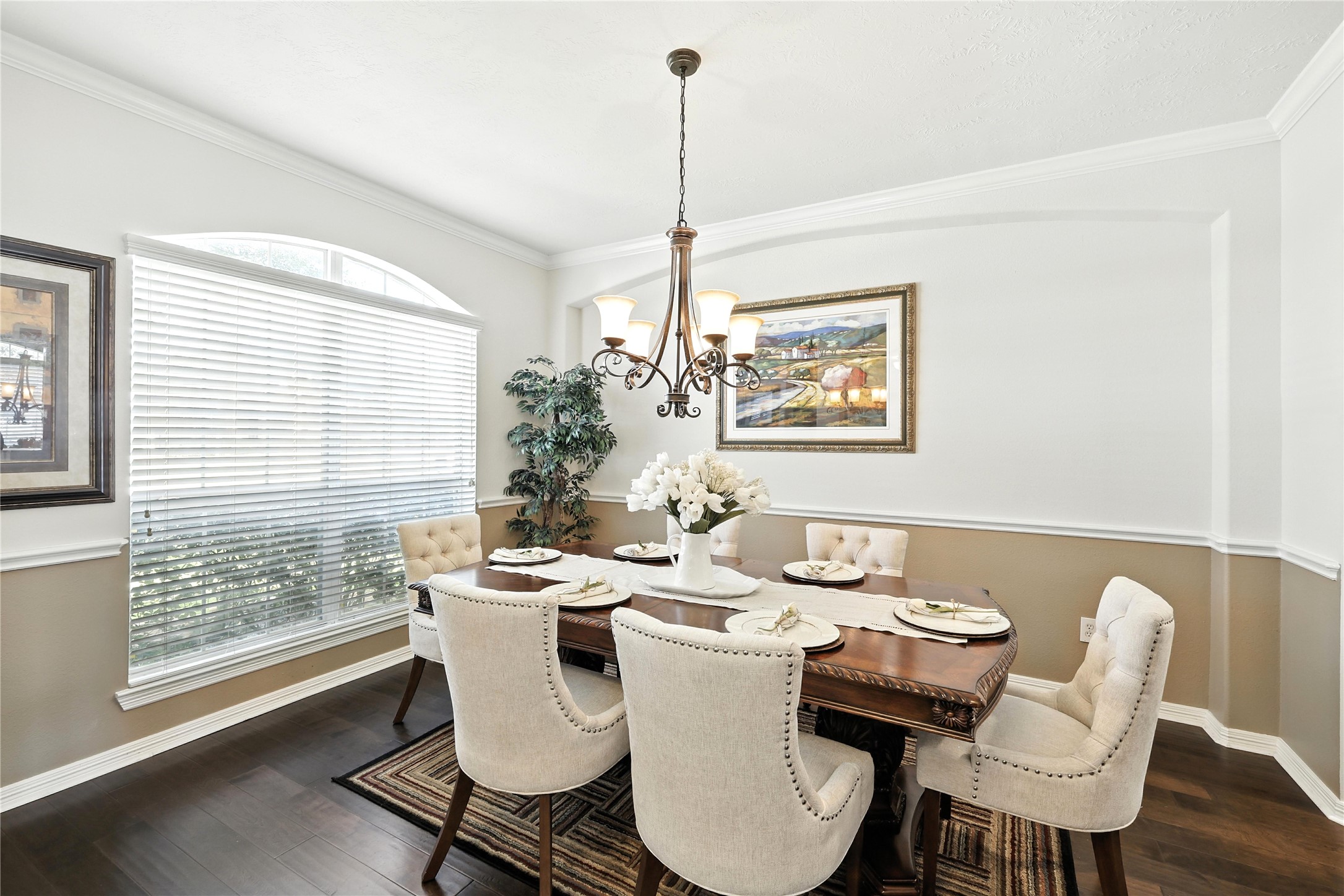 25218 Piney Heights Lane Spring, TX 77389 - Photo 6 of 40 a dining room with furniture a chandelier and wooden floor