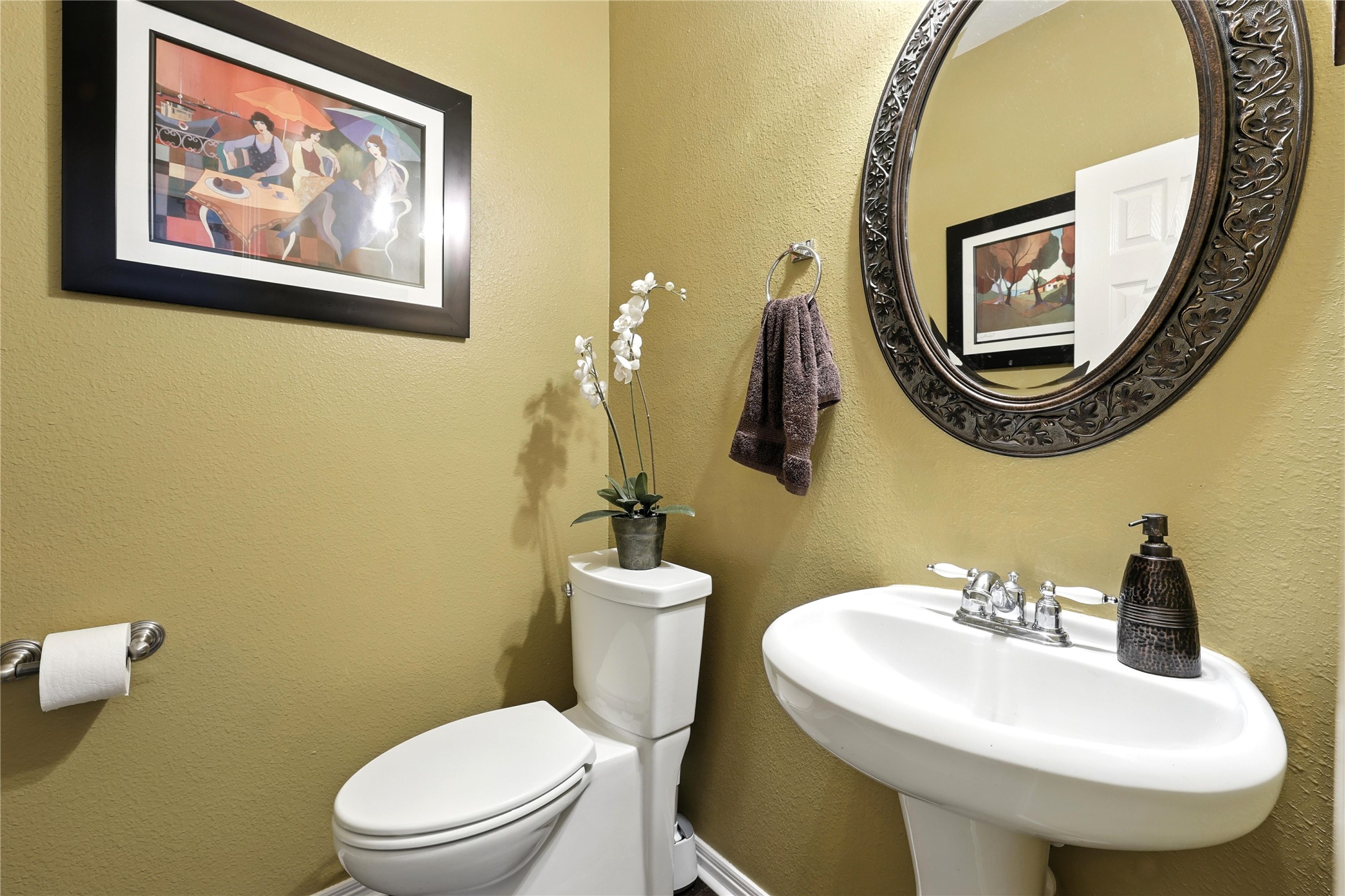 25218 Piney Heights Lane Spring, TX 77389 - Photo 7 of 40 a bathroom with a toilet a sink and a mirror