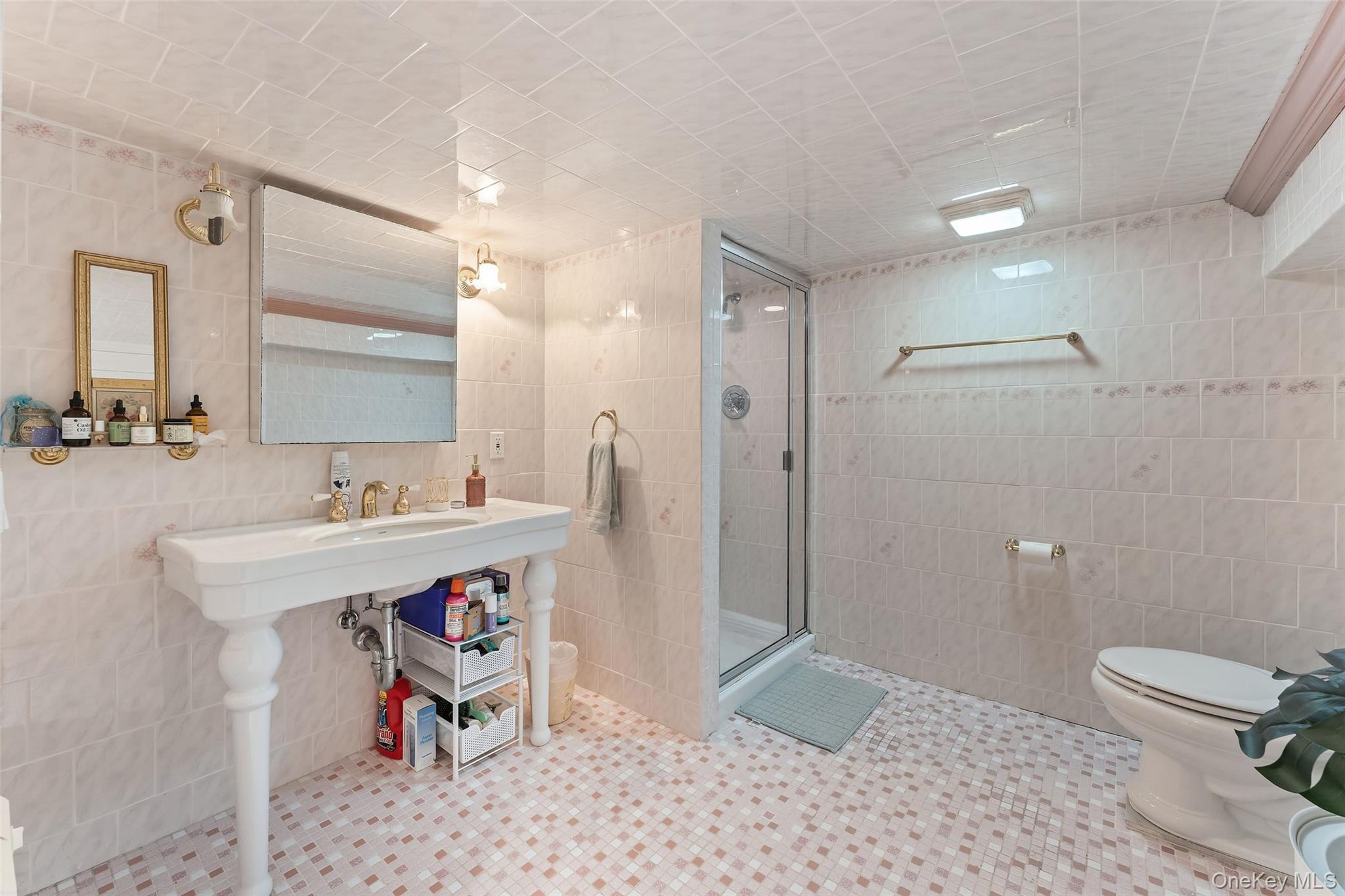 105 Cross Pond Road Pound Ridge, NY 10576 - Photo 36 of 49 a bathroom with a sink a toilet and shower