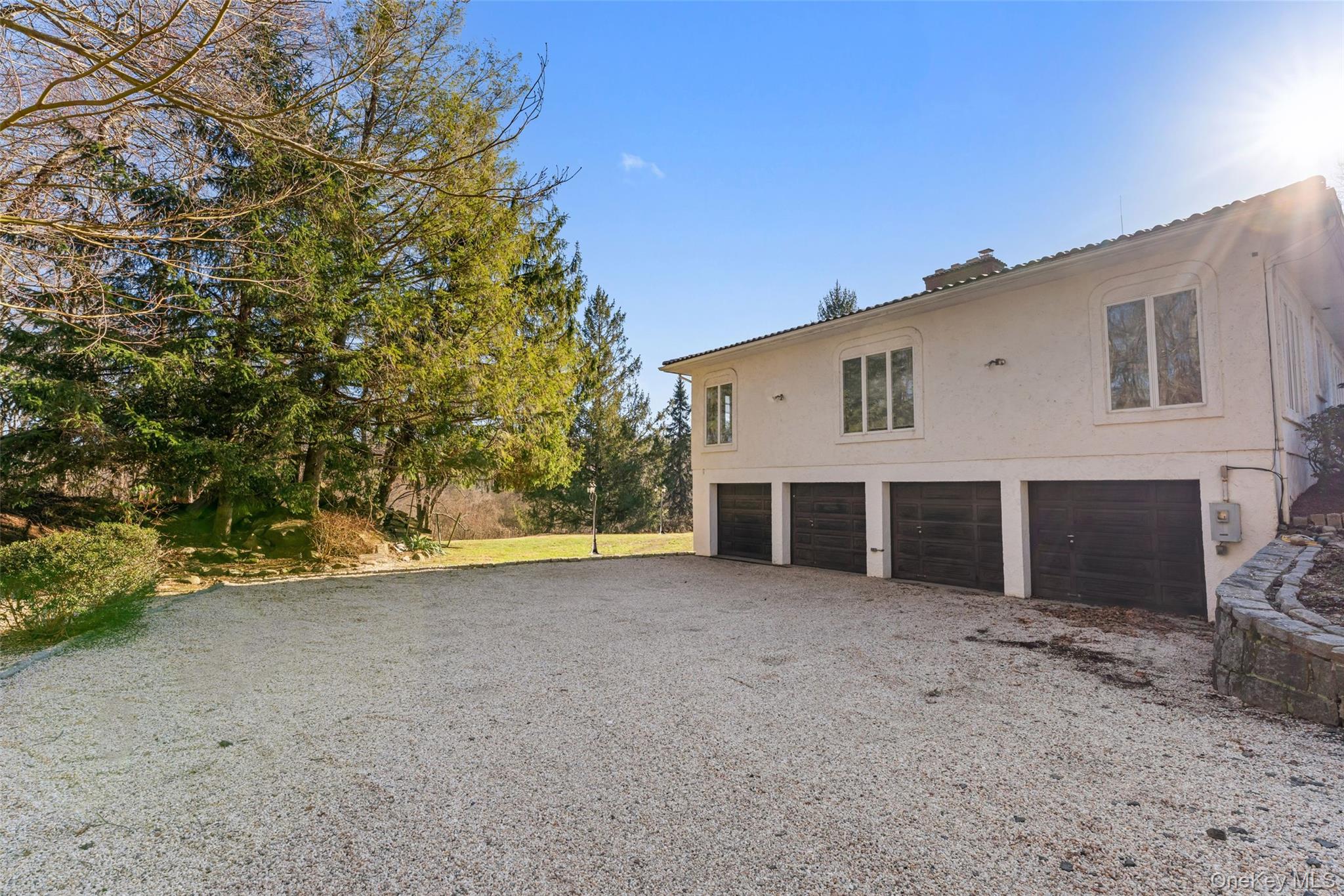 105 Cross Pond Road Pound Ridge, NY 10576 - Photo 46 of 49 a view of a house with a yard