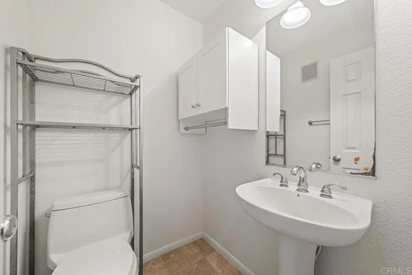 a bathroom with a sink and mirror