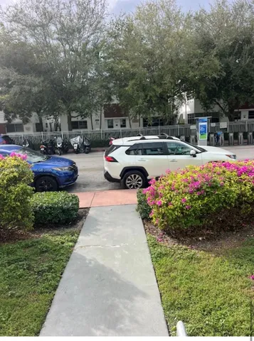 a front view of a building with garden