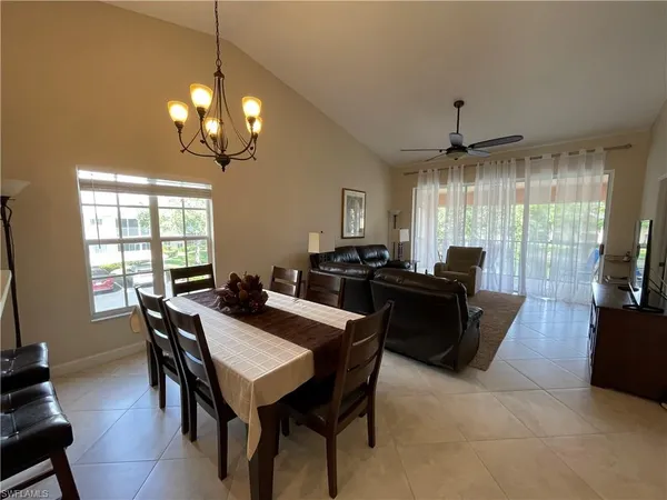 a large kitchen with a table and chairs