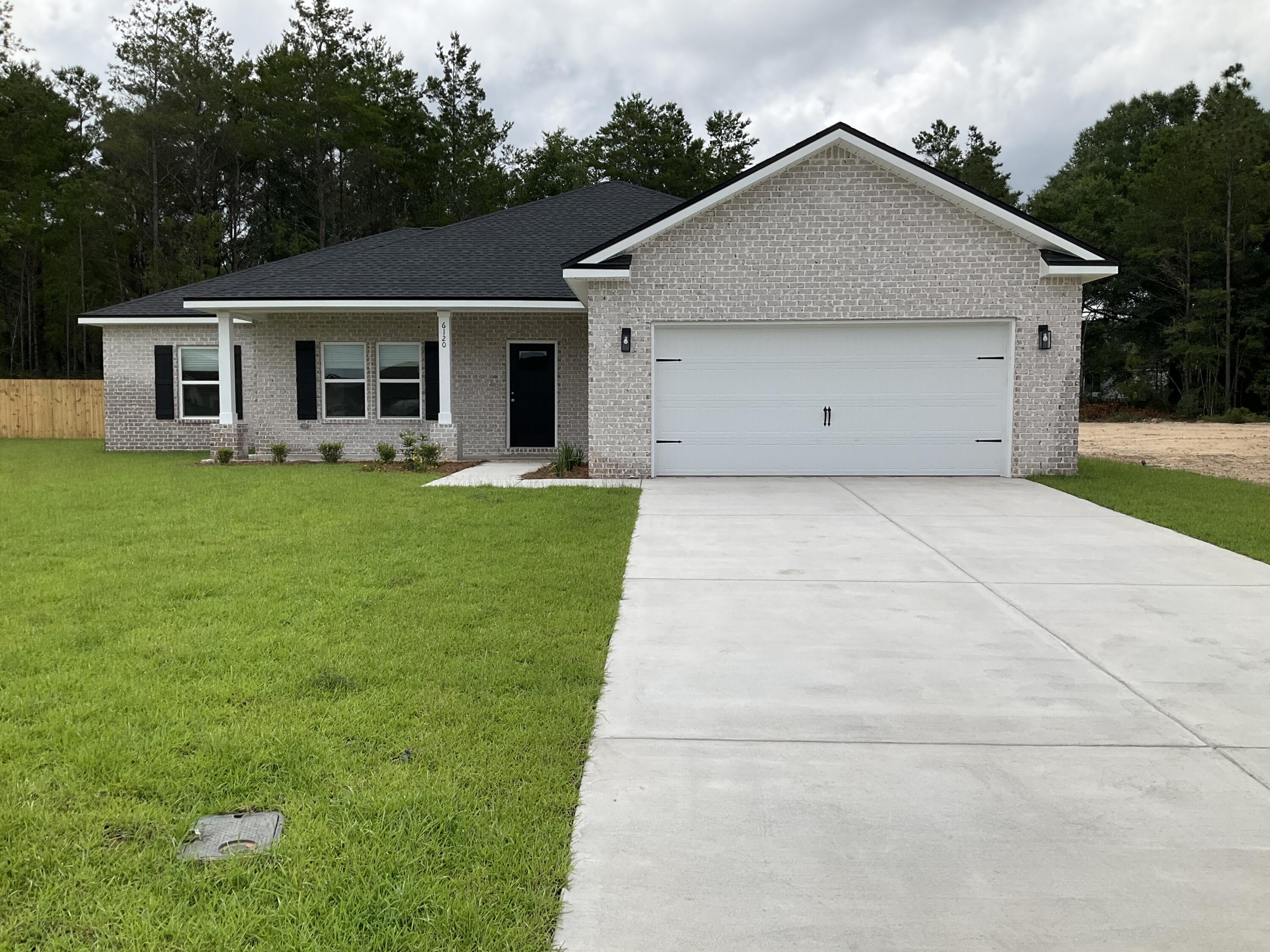 6120 Mildreds Way Crestview, FL 32539 - Photo 1 of 22 a front view of house with yard and green space