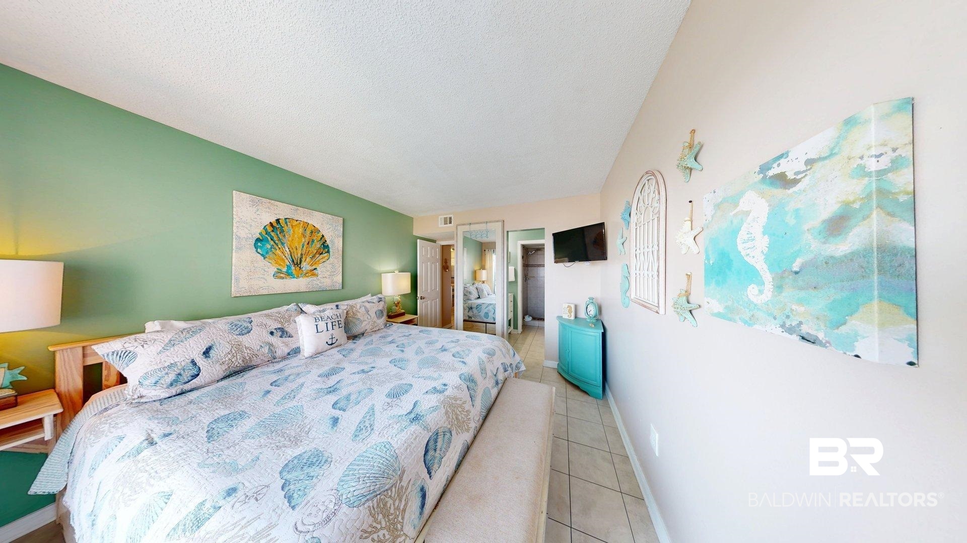 645 Plantation Road, Unit 6503 Gulf Shores, AL 36542 - Photo 37 of 53 Bedroom with light tile patterned floors and a textured ceiling