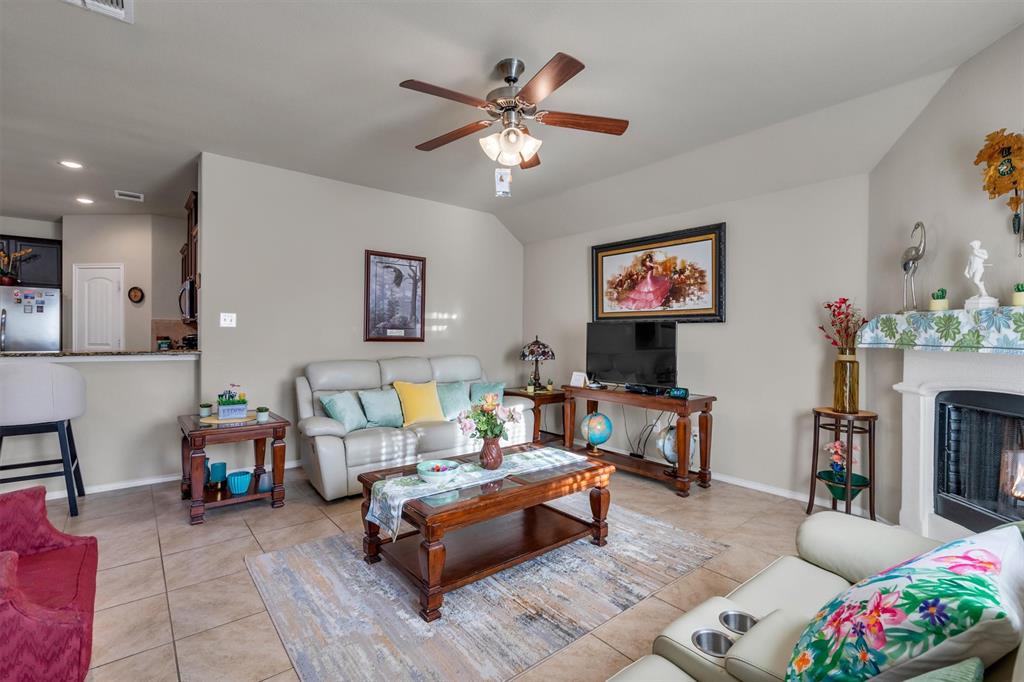 520 Rustic Oak Lane McKinney, TX 75072 - Photo 17 of 37 a living room with furniture and a fireplace