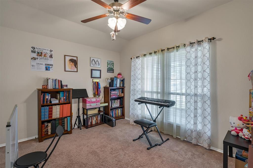 520 Rustic Oak Lane McKinney, TX 75072 - Photo 27 of 37 a view of a workspace with furniture and a window