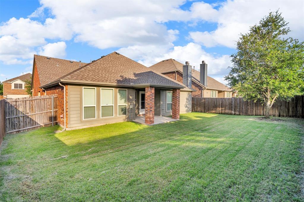 520 Rustic Oak Lane McKinney, TX 75072 - Photo 36 of 37 a view of a house with a yard and sitting area