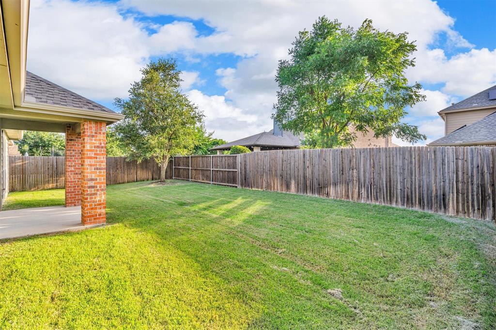 520 Rustic Oak Lane McKinney, TX 75072 - Photo 37 of 37 a view of a backyard with a garden