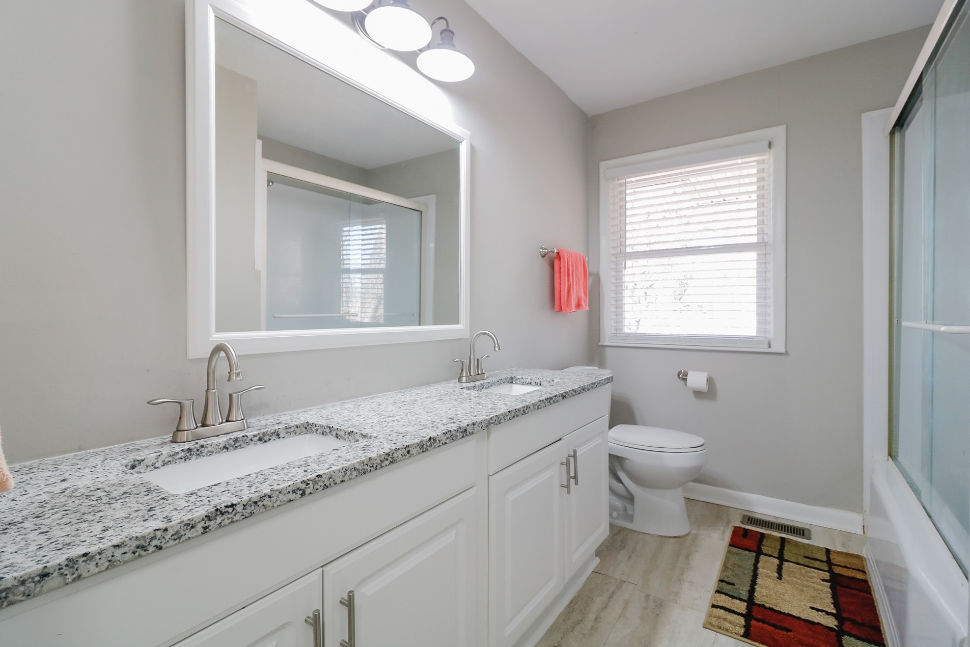 2202 Ruth Street Springfield, TN 37172 - Photo 44 of 51 a bathroom with a granite countertop sink mirror vanity and a toilet