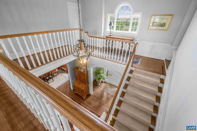 a dining room with furniture window and wooden floor