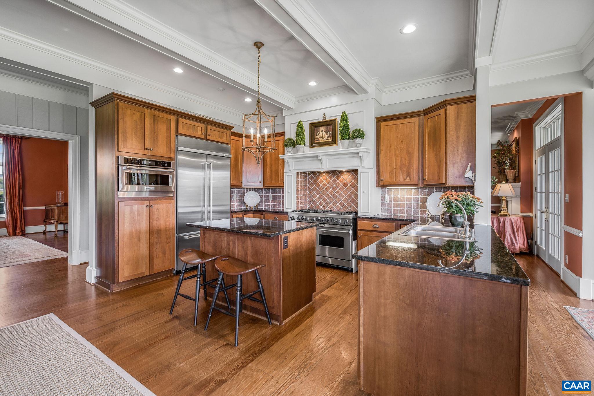 3365 Stony Point Road Charlottesville, VA 22911 - Photo 30 of 75 a kitchen with stainless steel appliances granite countertop dining table chairs refrigerator and sink
