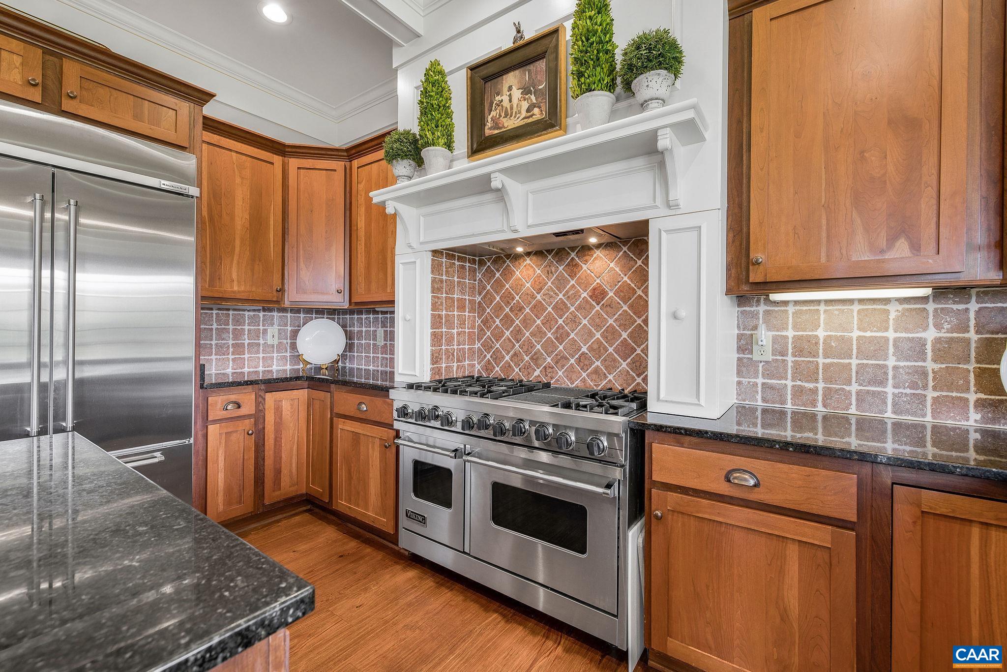 3365 Stony Point Road Charlottesville, VA 22911 - Photo 31 of 75 a kitchen with stainless steel appliances granite countertop a stove a sink and a refrigerator