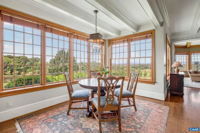 a view of entryway bedroom and hall with wooden floor