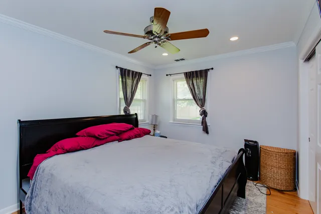 a bedroom with a bed and window