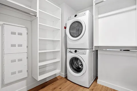 a utility room with washing machine