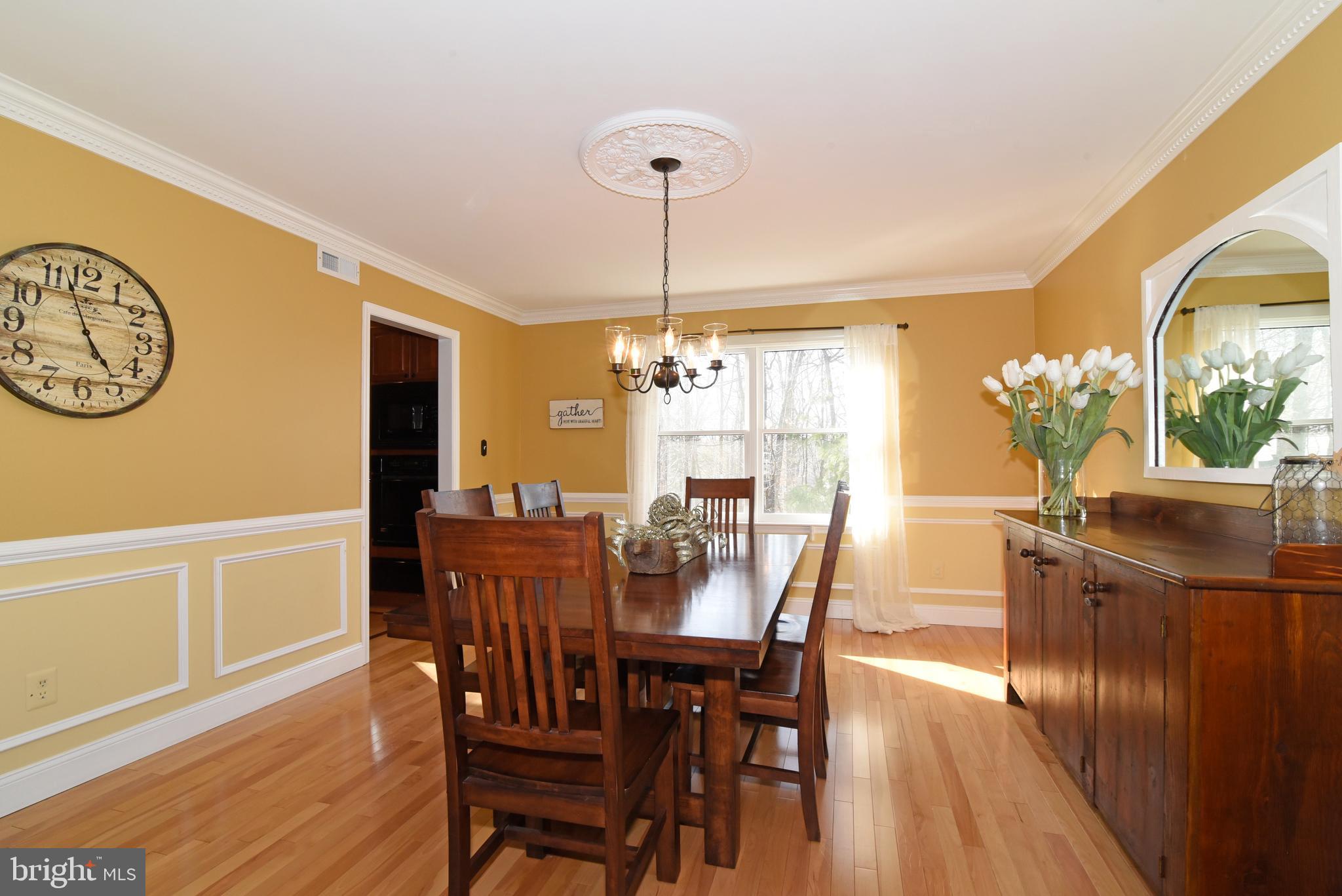 2208 Spinnaker Court Reston, VA 20191 - Photo 8 of 39 a view of a dining room with furniture window and wooden floor