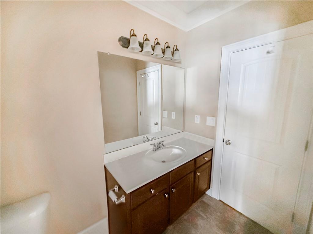 142 Liberty Trace Milner, GA 30257 - Photo 12 of 33 a bathroom with a sink a mirror and a shower